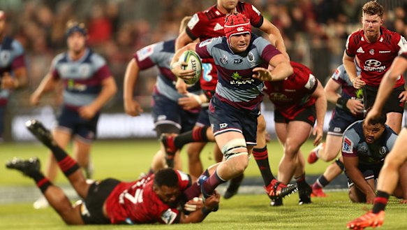 Harry Wilson makes a break against the Crusaders.