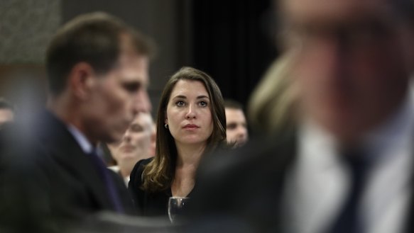 Journalist Annika Smethurst, whose home was raided by the Australian Federal Police, listens on as media bosses call for greater press freedom.