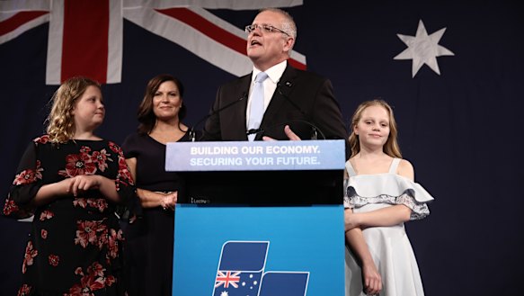 Flanked by his wife and daughters, Scott Morrison declares victory in front of the party faithful on May 18, 2019.