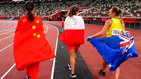 Gold medallist Liu Shiying with silver medallist Maria Andrejczyk and Kelsey-Lee Barber.