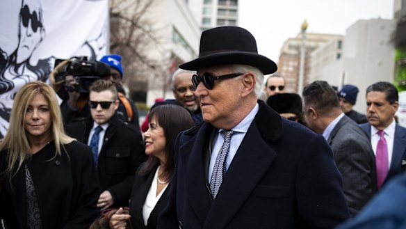 Roger Stone, former adviser to Donald Trump's presidential campaign, centre, and his wife Nydia Stone, left, at federal court in Washington, DC.