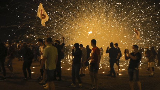 Police use smoke grenades during a protest after the Belarusian presidential election in Minsk, Belarus.