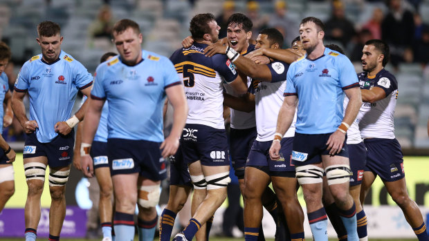 Waratahs players watch on as the Brumbies celebrated Nick Frost’s try on Saturday night.