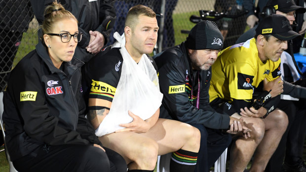 Painful viewing: Trent Merrin watches from the sidelines at Bathurst on Friday night.