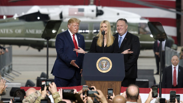 US President Donald Trump and US secretary of state Mike Pompeo, right, look on as White House Senior Advisor Ivanka Trump speaks to military personnel and their families stationed in South Korea in Osan Air Base on Sunday.