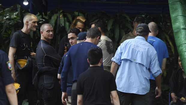 Australian doctor Richard Harris (in light blue shirt) at the base camp where the rescue operations are now under way.