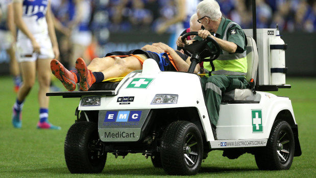 Liam Jones is stretchered off the field.