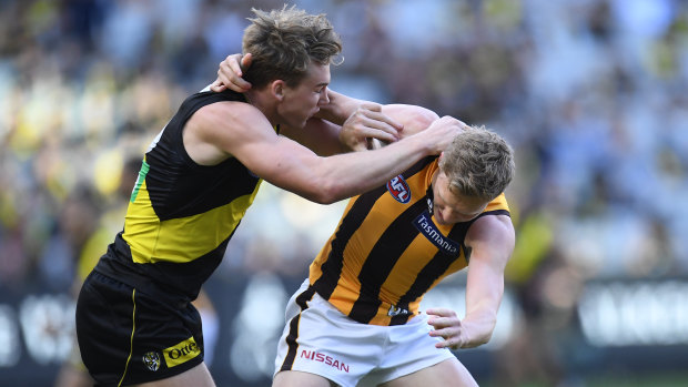 Tempers flare: Richmond's Tom Lynch scuffles with Hawk James Sicily.
