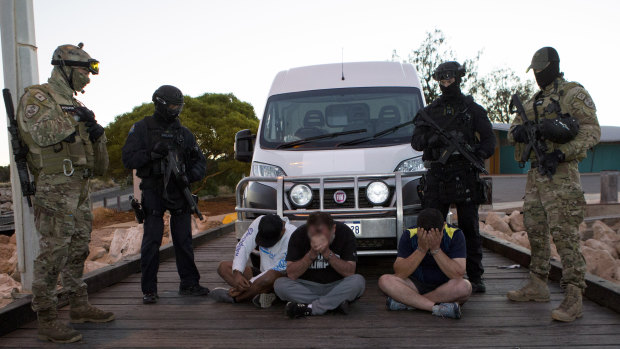 Police with some of those arrested back in December 2017.