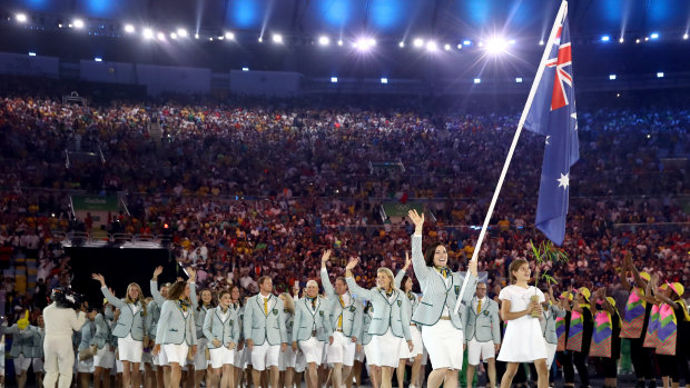 Meares carries the Australian flag at the opening ceremony of the 2016 Olympic Games in Rio.