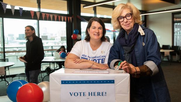 Down Under Democrats Kristen Gordon (left) and and Laurie Staub at the polling booth in Docklands on Saturday.