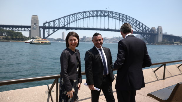 Then-premier Gladys Berejiklian, then-deputy premier John Barilaro and then-treasurer Dominic Perrottet announcing the trade roles in 2019.