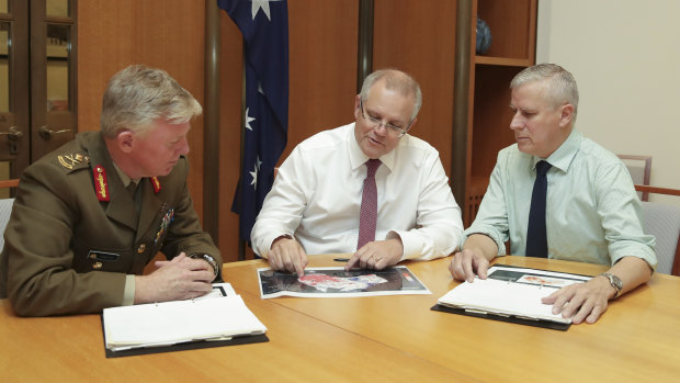 Mr Morrison meeting with National leader Michael McCormack and national drought coordinator Major General Stephen Day.