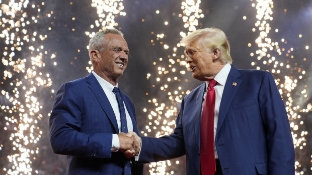 Donald Trump (right) shakes hands with Robert F. Kennedy Jr at a campaign rally in Arizona.
