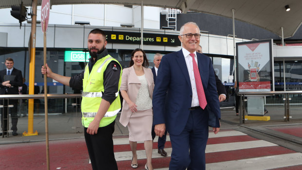 Prime Minister Malcolm Turnbull and Revenue and Financial Services Minister Kelly O'Dwyer arrive for a press conference at Melbourne Airport on Thursday. 