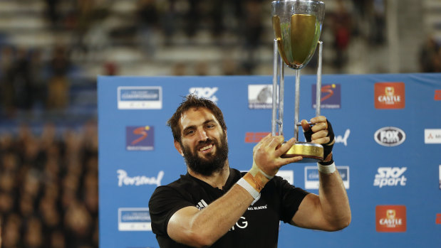 More silverware: Sam Whitelock holding the Rugby Championship trophy aloft.