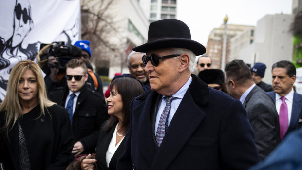 Roger Stone, former adviser to Donald Trump's presidential campaign, centre, and his wife Nydia Stone, left, at federal court in Washington, DC.