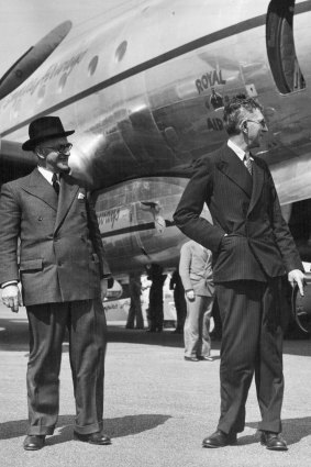 Reappointed ... Managing Director and chairman of directors Mr Hudson Fysh (right) with Minister for Air and Civil Aviation, Mr Arthur Drakeford.