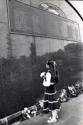 On the day the bridge opened, Christine Fitzsimmonds, 9, stood before the memorial plaque at the base of the bridge and wiping a tear from her eye, laid a floral tribute to her father, Bernard, one of 35 men who died in the disaster.