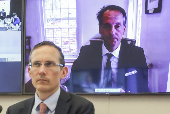 ASIC chair James Shipton appearing via teleconference on Friday, and Labor MP Andrew Leigh (in foreground).