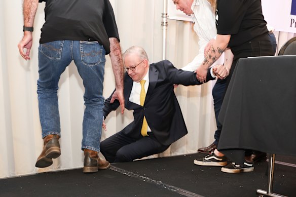 Albanese initially denied he fell off the stage.