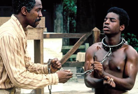 Louis Gossett as Fiddler (left), with Kunta Kinte (LeVar Burton) in the 1977 mini-series Roots.
