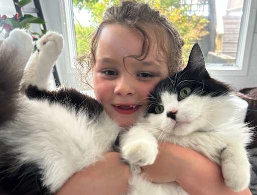 Charlie cuddles the ever-compliant Sparkles.