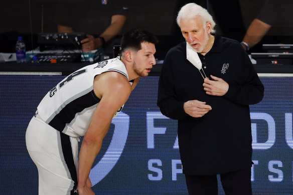 Spurs coach Gregg Popovich (right) with Drew Eubanks.