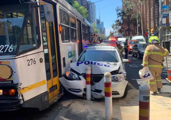 A tram and a police divvy van collided on Spencer Street on Tuesday.
