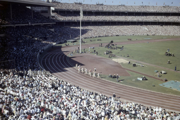Crowds watch the opening ceremony of the 1956 Summer Olympics in Melbourne. 