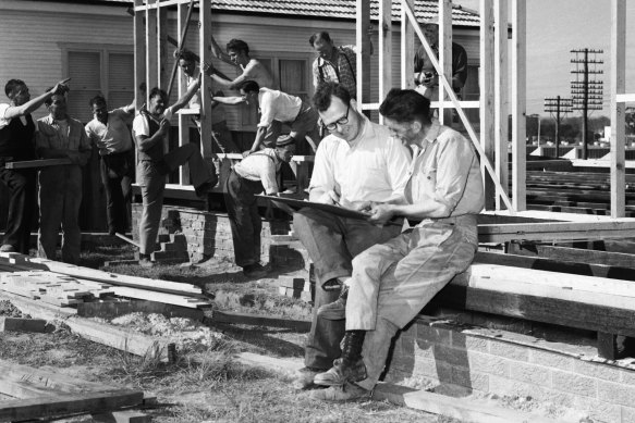 Post-war British immigrants help build each other’s houses in Liverpool.
