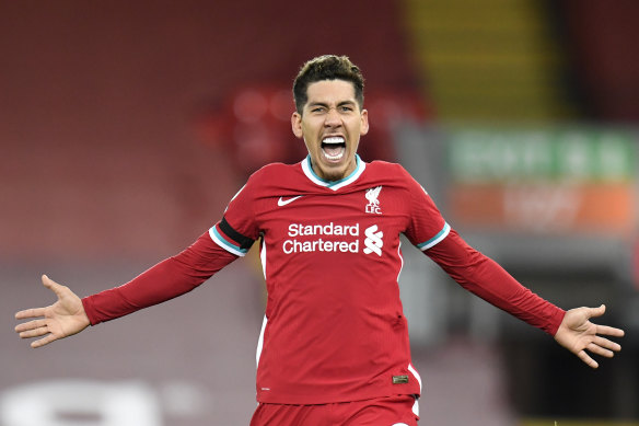 Roberto Firmino celebrates the goal which opened up a three-point lead for Liverpool at the top of the Premier League table.