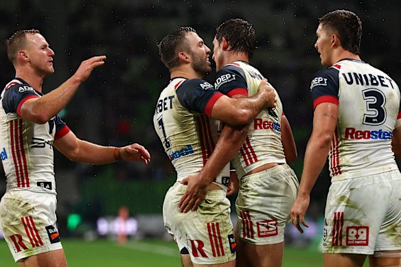 The Roosters celebrate during Saturday night’s clash with the Storm in Melbourne.