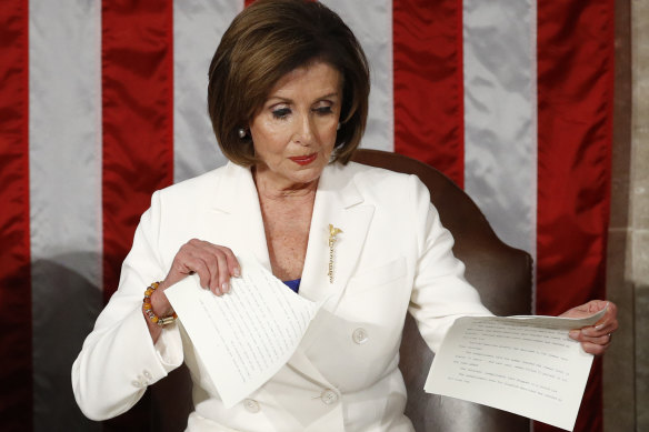 Nancy Pelosi tears up her copy of Donald Trump's State of the Union speech.