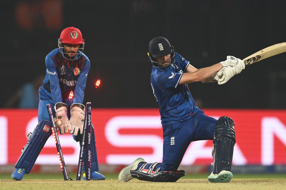 England’s Mark Wood is bowled by Rashid Khan for the final wicket of the match.