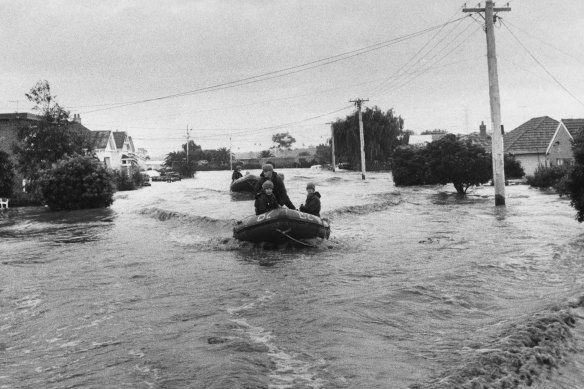 Army dinghies patrol Navigator Street in Maribyrnong during the 1974 flood.