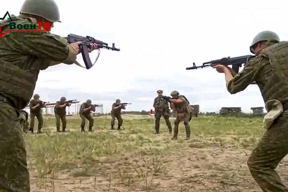 Belarusian soldiers attend a training by mercenary fighters from Wagner private military company near Tsel village, southeast of Minsk, Belarus.