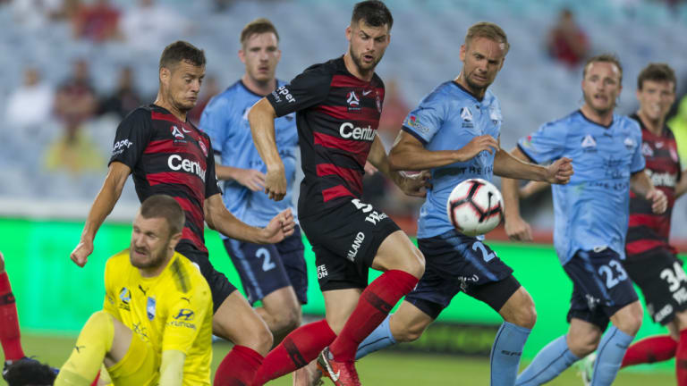 Heavy traffic: Oriol Riera opens the score for the Wanderers but their positive start was soon undone.