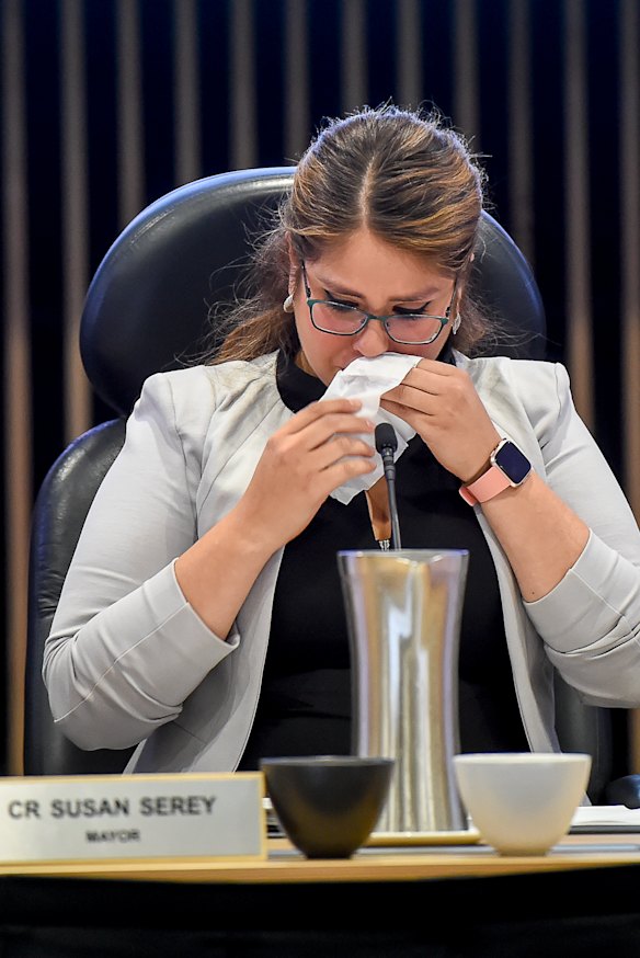 Susan Serey fights back tears at last month's council meeting. The council was about to be sacked.