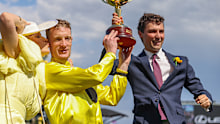 Top trainer Sam Freedman (right) celebrates the 2023 Melbourne Cup win alongside Without A Fight jockey Mark Zahra.