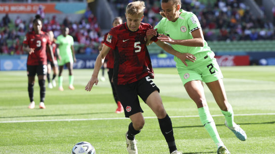 Canada’s Quinn and Nigeria’s Ashleigh Plumptre battle for the ball during the Women’s World Cup Group B soccer match between Nigeria and Canada in Melbourne, Australia, Friday, July 21, 2023.