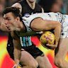 Hard at it: Jagga Smith and Jason Horne-Francis battle for possession on Saturday night.