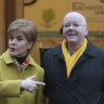 Then-Scottish first minister Nicola Sturgeon poses for the media with husband Peter Murrell, outside polling station in Glasgow, Scotland in 2019.