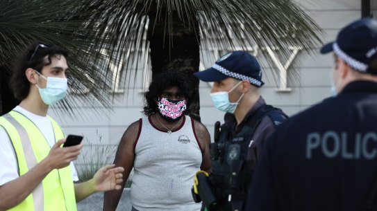 Police question a protester at Sydney Unveristy during a demonstartion over cutbacks.
