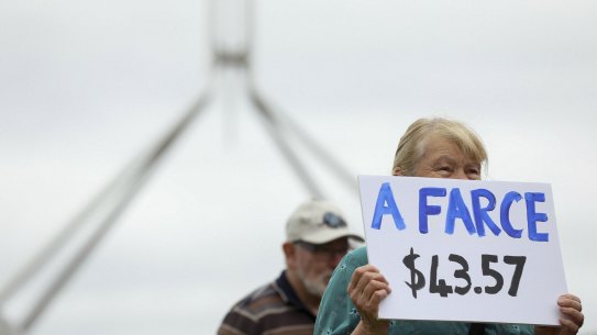 People protest against the low rate of the Jobseeker payment outside Parliament House in Canberra this week.