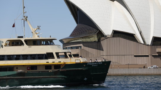 A Freshwater ferry passes the Sydney Opera House ... would the latter have been built had it been subjected to a crude cost-benefit analysis? Yet its economic return for Sydney is not questioned today.  