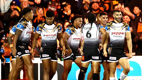 The Tigers celebrate their opening try.