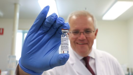 Prime Minister Scott Morrison holds up the AstraZeneca COVID-19 vaccine. Vaccination will ensure the nation’s health prepares it to face the economic challenges of recovery. 