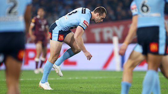 Isaah Yeo stumbles after being hit while making the opening tackle of the match.