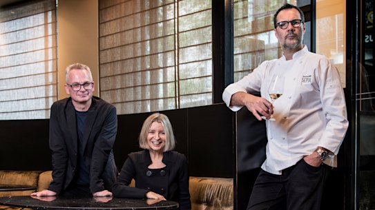 In happier times: Rodney Setter (left) is suing Vicki Wild and Martin Benn. The three are pictured at Sepia in December 2018 prior to its closure.